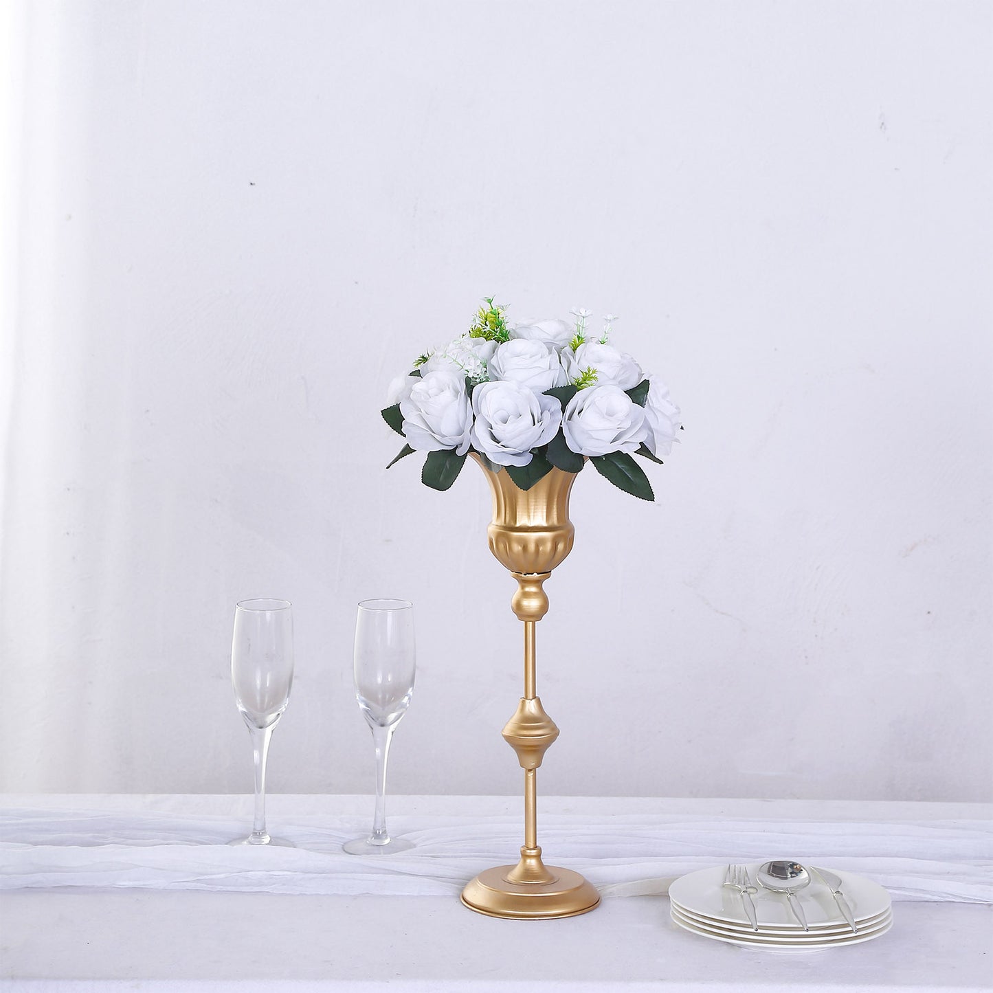 White silk rose flower ball centerpiece arrangement in a gold vase.