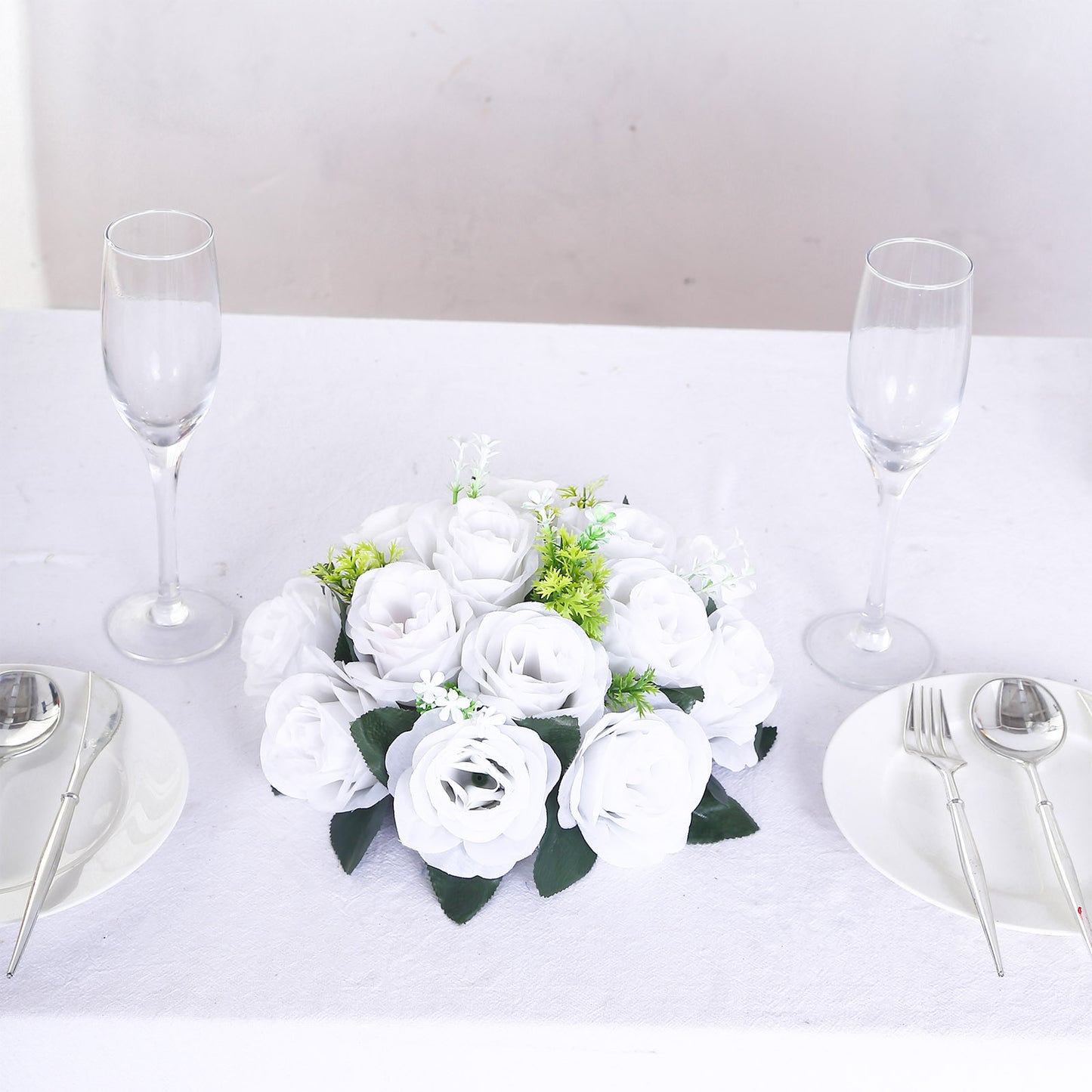 White silk rose flower ball centerpiece arrangement for table decor.