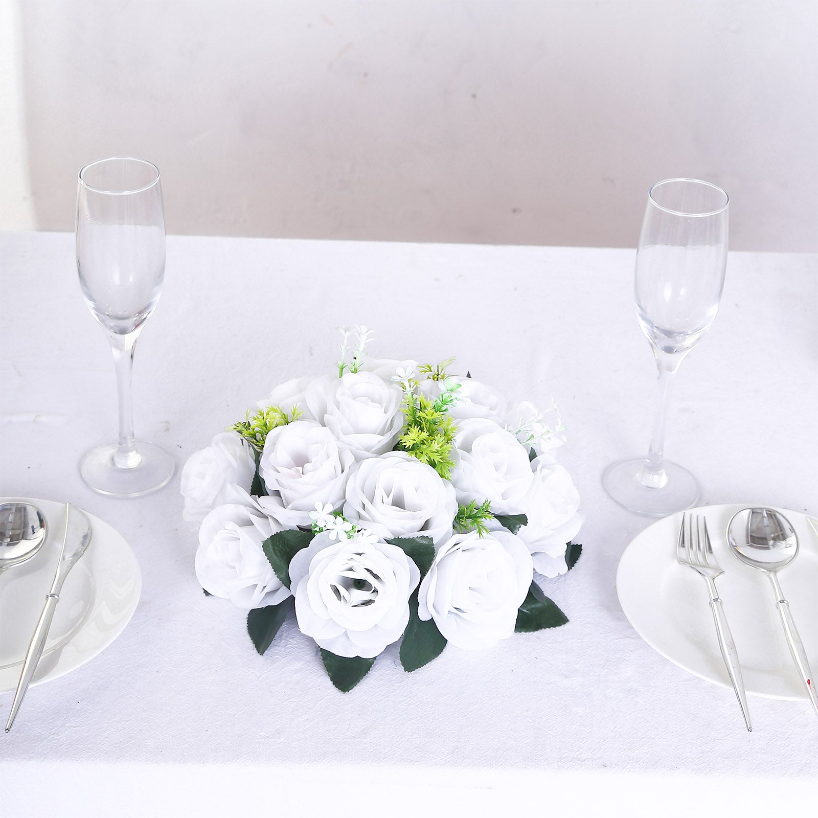 White silk rose flower ball centerpiece arrangement for table decor.