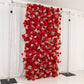 Red artificial flower wall panel backdrop with silk roses and baby's breath.