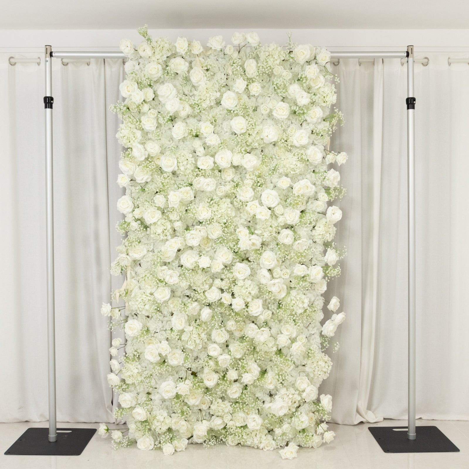 White silk roses and baby's breath artificial flower wall backdrop.