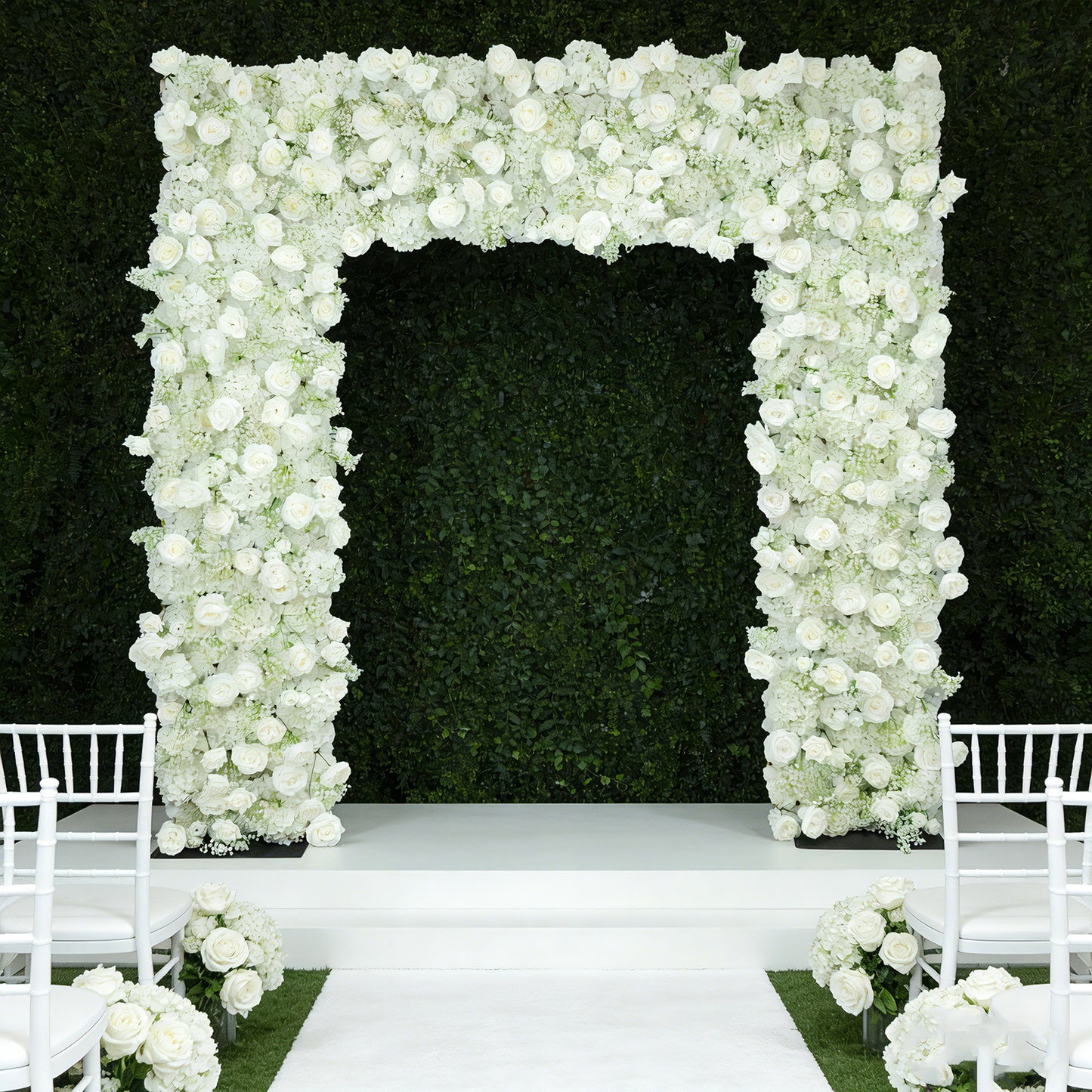 White floral backdrop for wedding arch with silk roses and baby's breath.