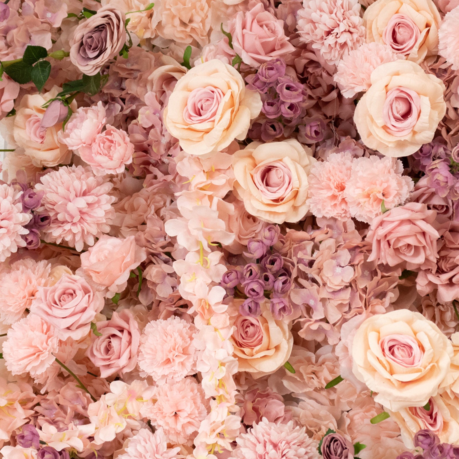 Dusty rose floral backdrop with silk roses and hydrangeas.