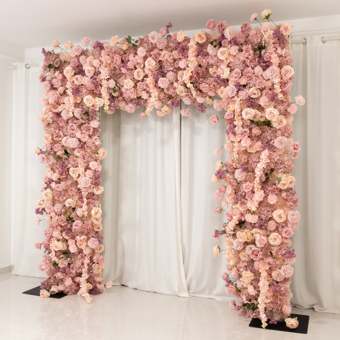 Dusty rose flower backdrop with artificial silk roses and hydrangeas for weddings.