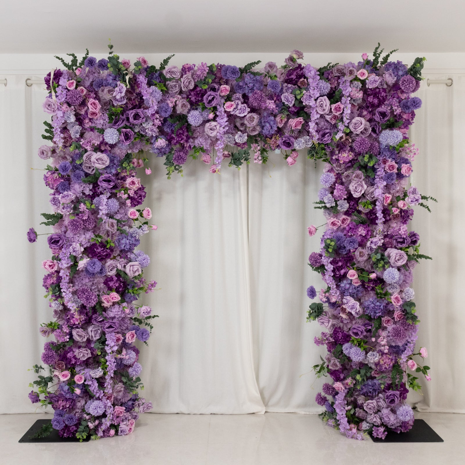Lavender lilac flower backdrop for weddings with artificial silk roses and hydrangeas.