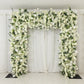 White roll-up flower backdrop with artificial silk roses, hydrangeas, and chrysanthemums.