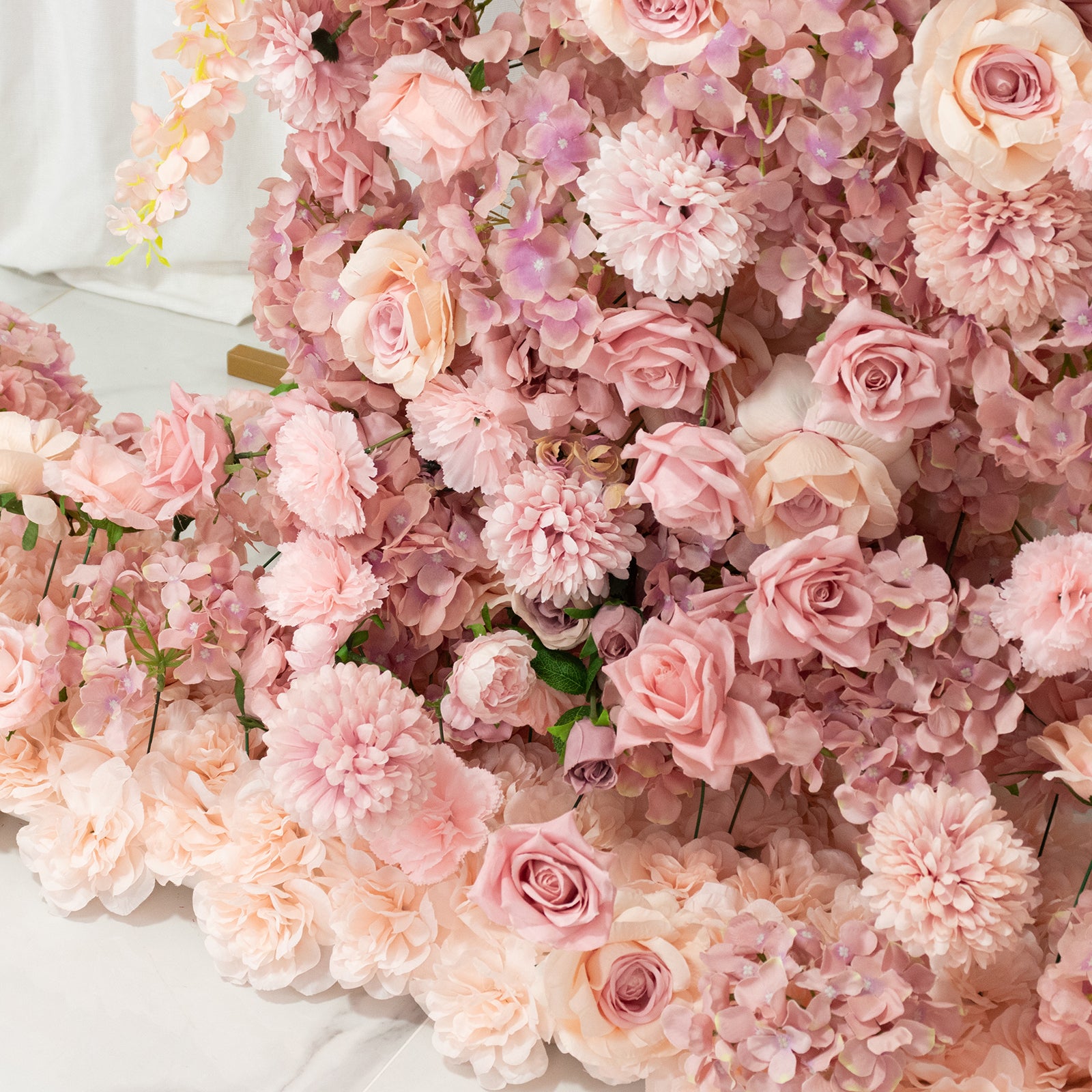 Dusty rose floral backdrop with roses, hydrangeas, and chrysanthemums.