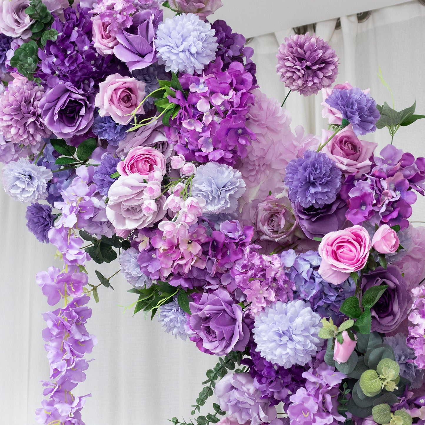 Lavender floral backdrop with roses, hydrangeas, and chrysanthemums for wedding arch.