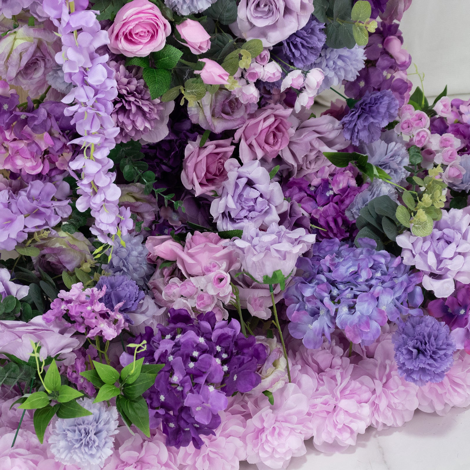Lavender floral backdrop with roses, hydrangeas, and chrysanthemums for wedding arch.