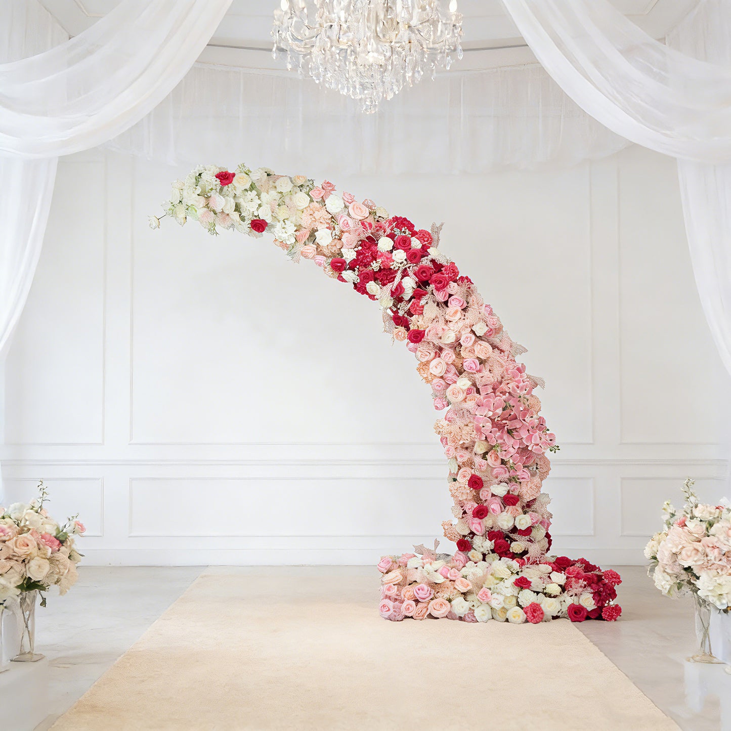 White and pink floral backdrop for wedding arch with roses and hydrangeas.