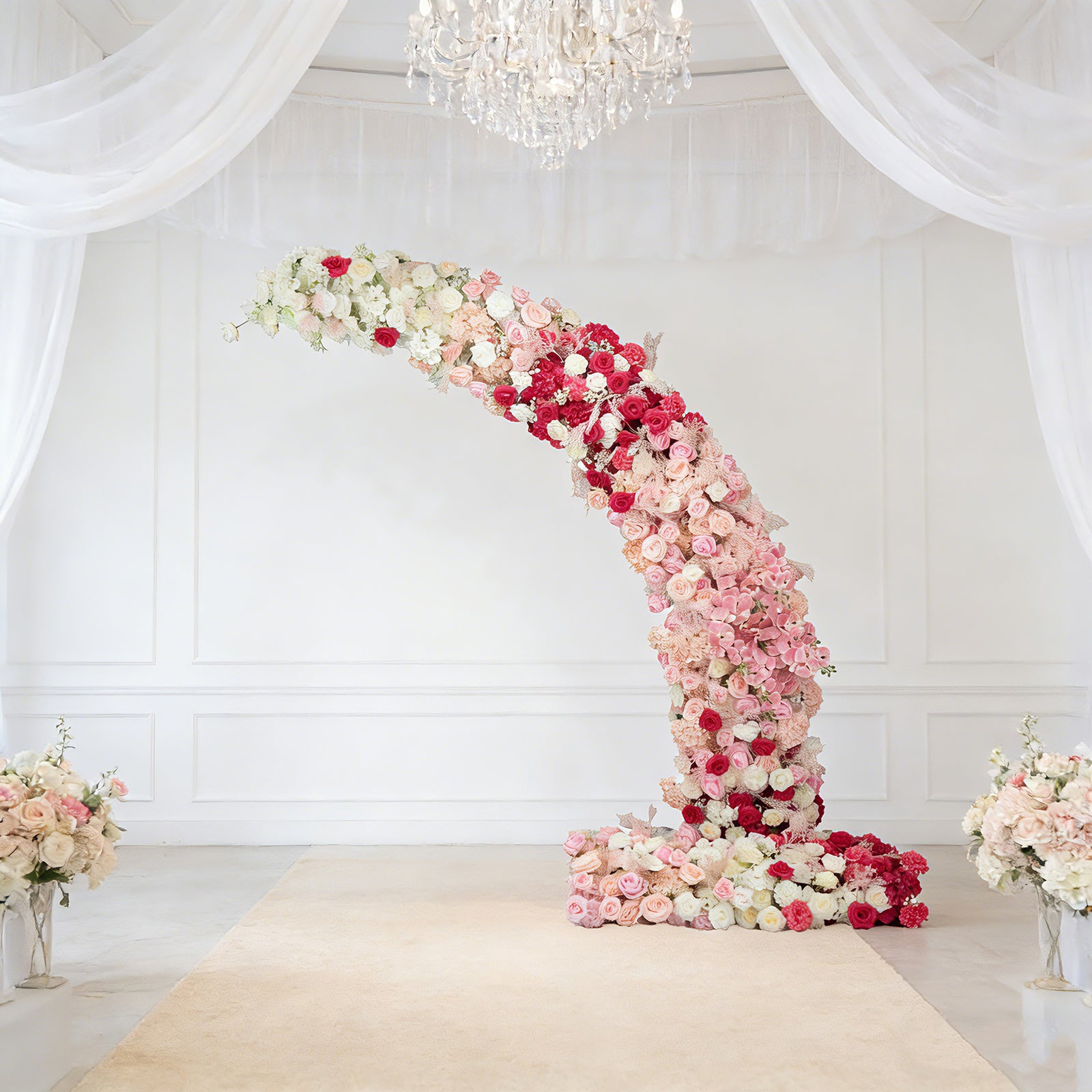 White and pink floral backdrop for wedding arch with roses and hydrangeas.