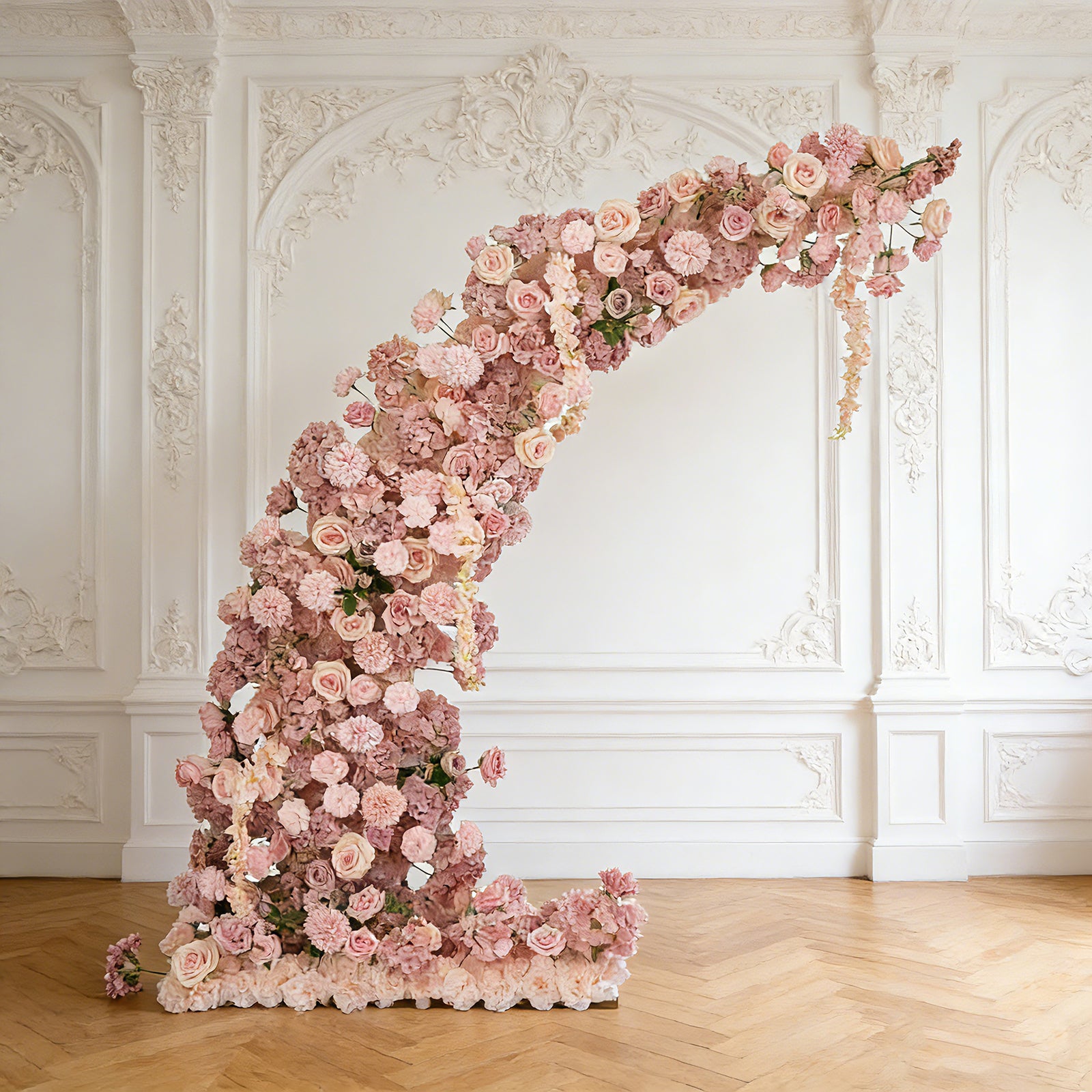 Dusty rose floral backdrop arch adorned with roses and hydrangeas.