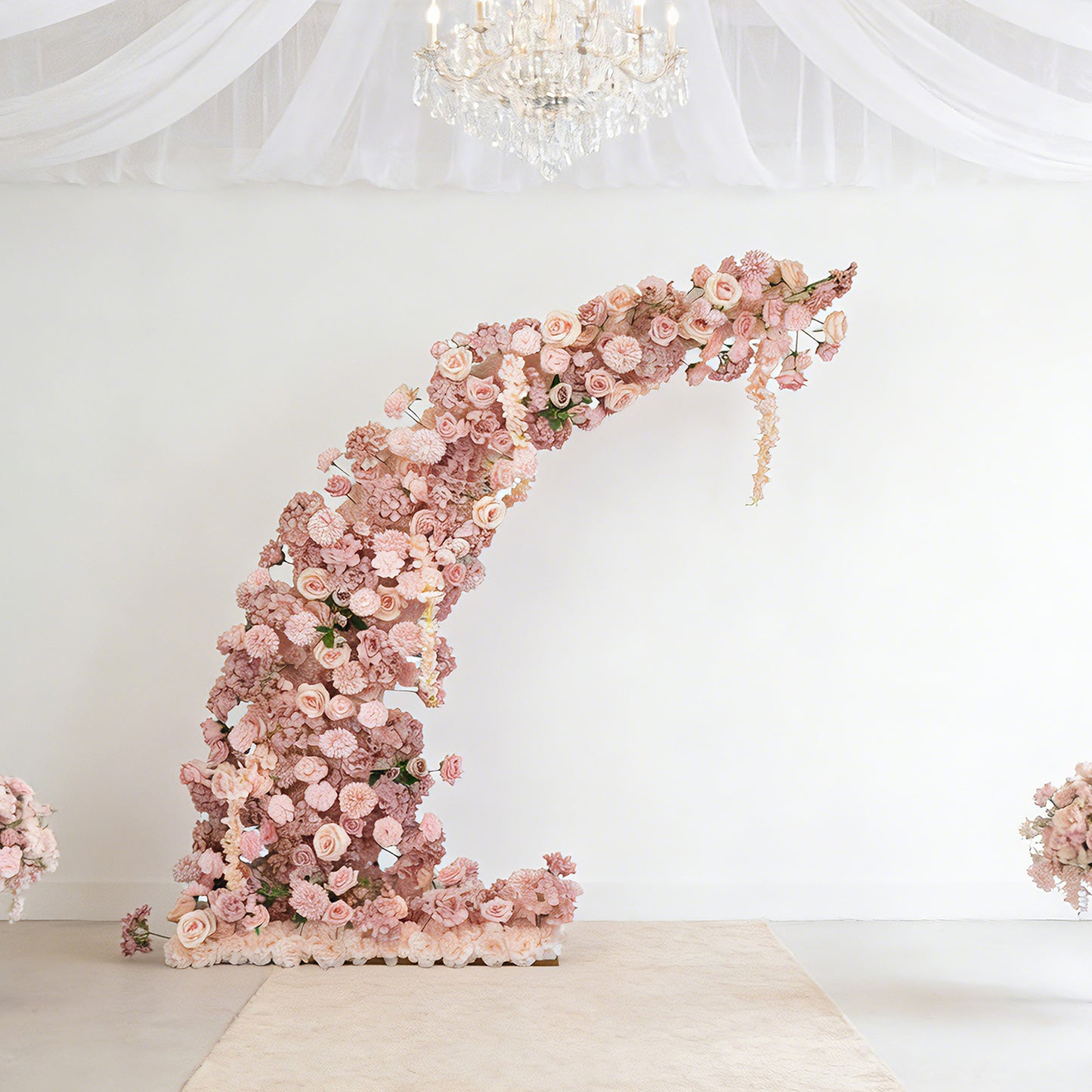 Dusty rose floral backdrop for wedding arch with roses and hydrangeas.