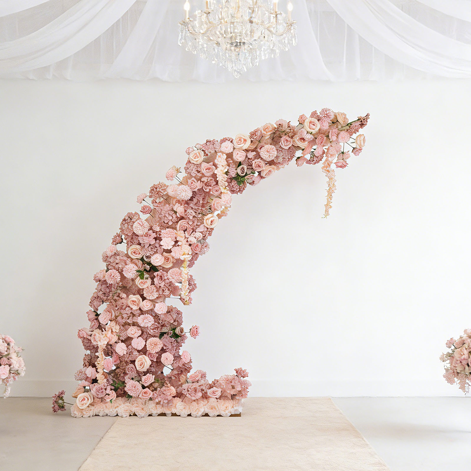 Dusty rose floral backdrop for wedding arch with roses and hydrangeas.