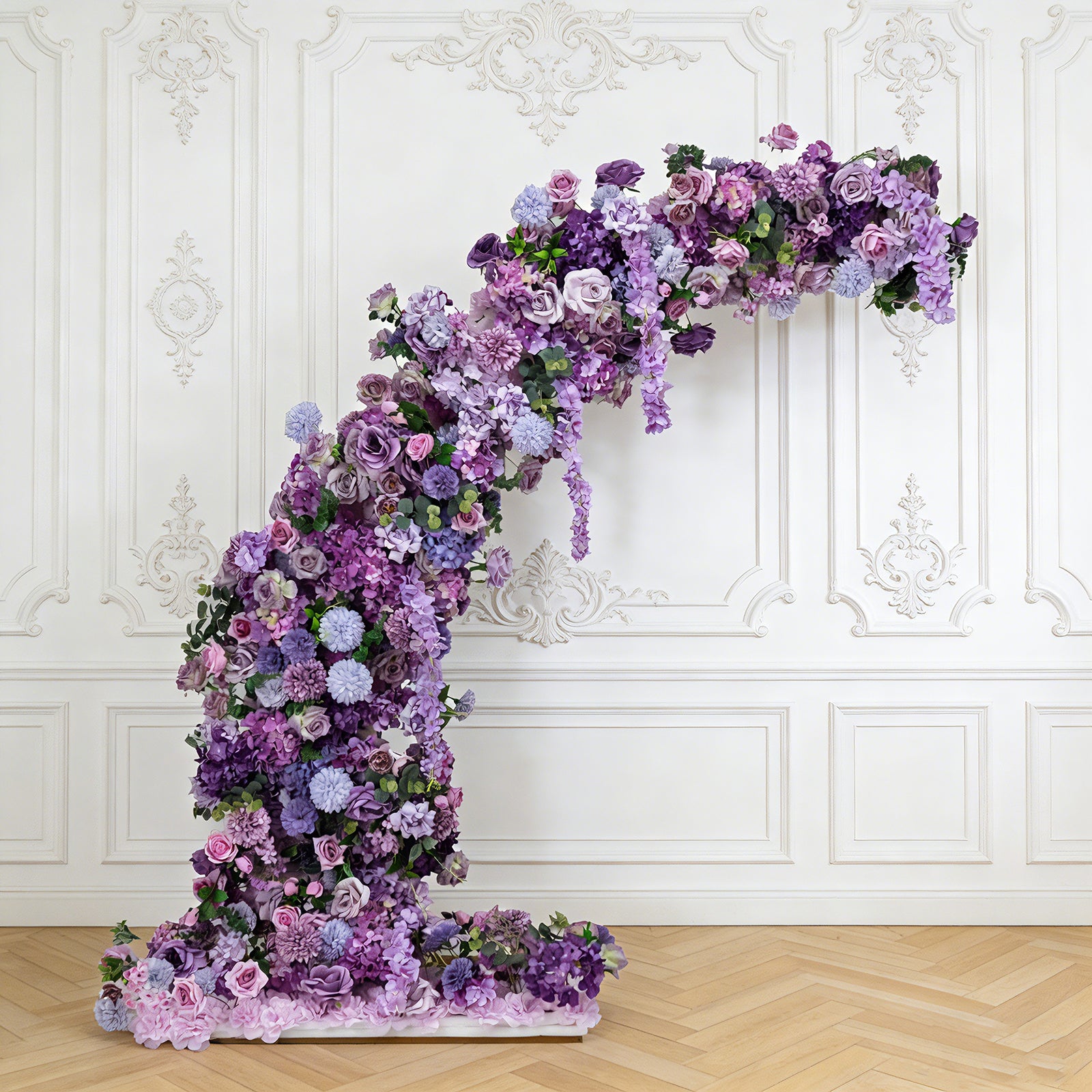 Lavender floral backdrop for a half crescent wedding arch with roses and hydrangeas.