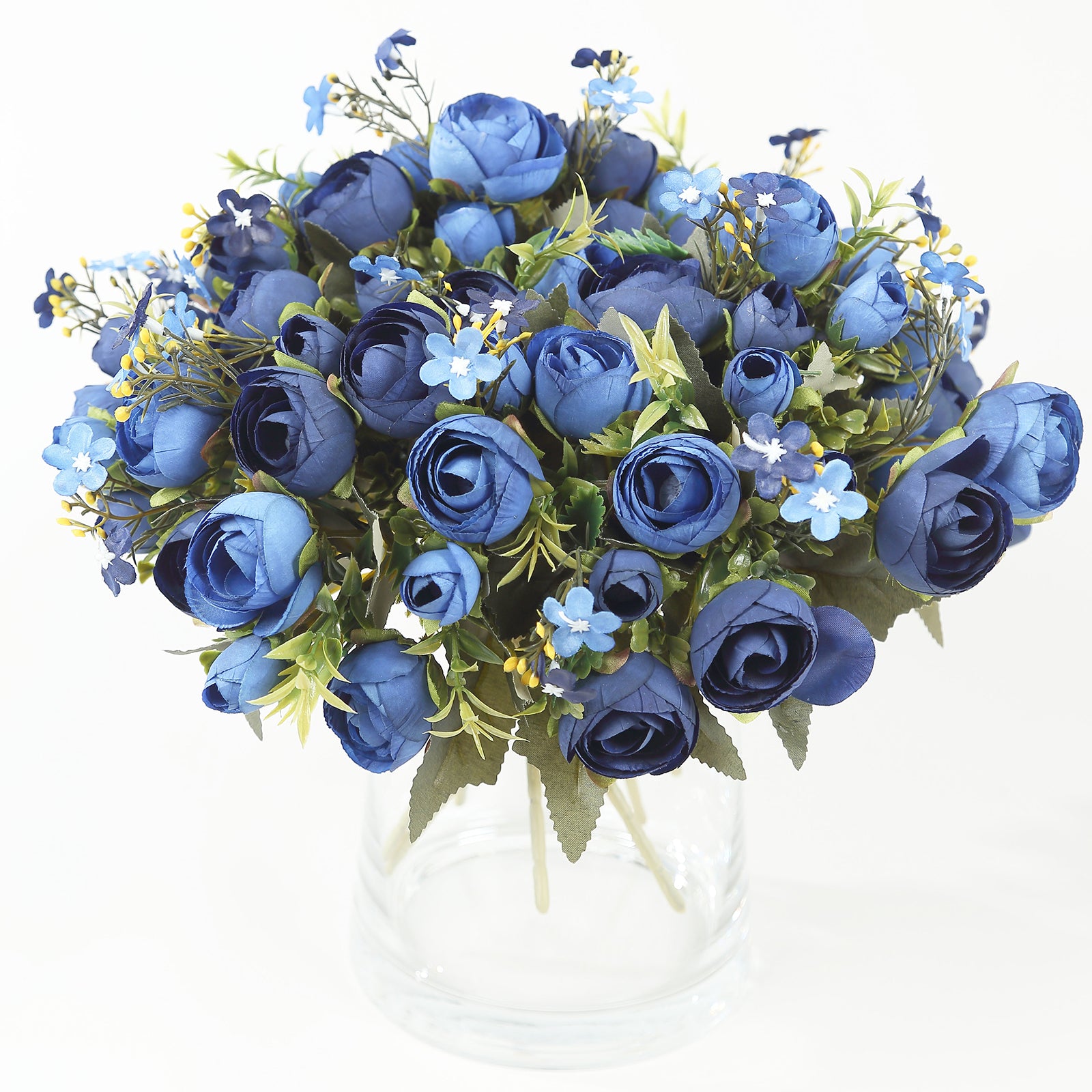 Navy blue artificial ranunculus floral arrangement in a clear vase.