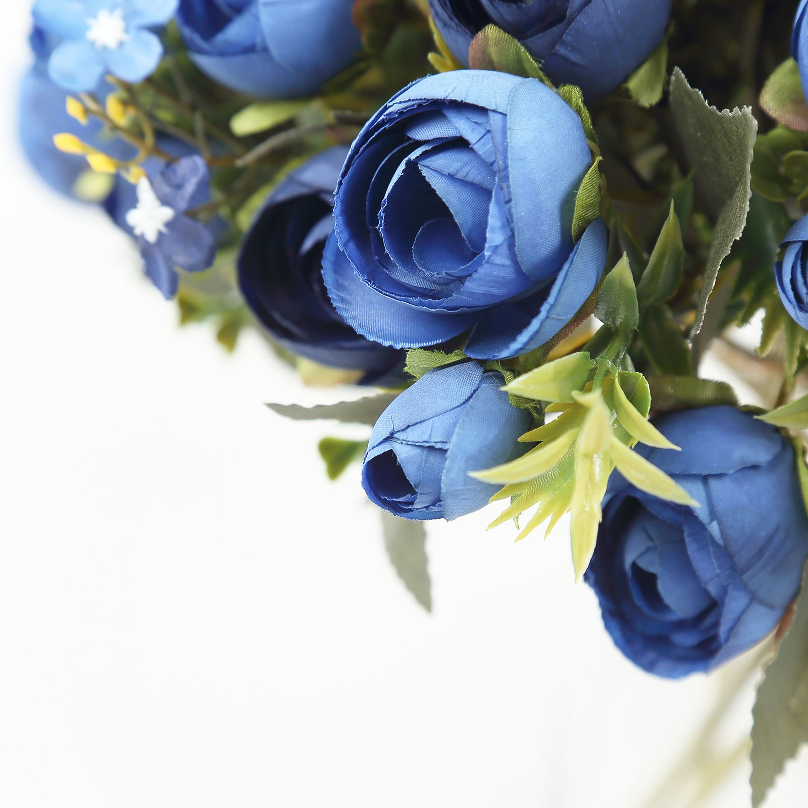 Navy blue artificial ranunculus silk flower bouquet arrangement.