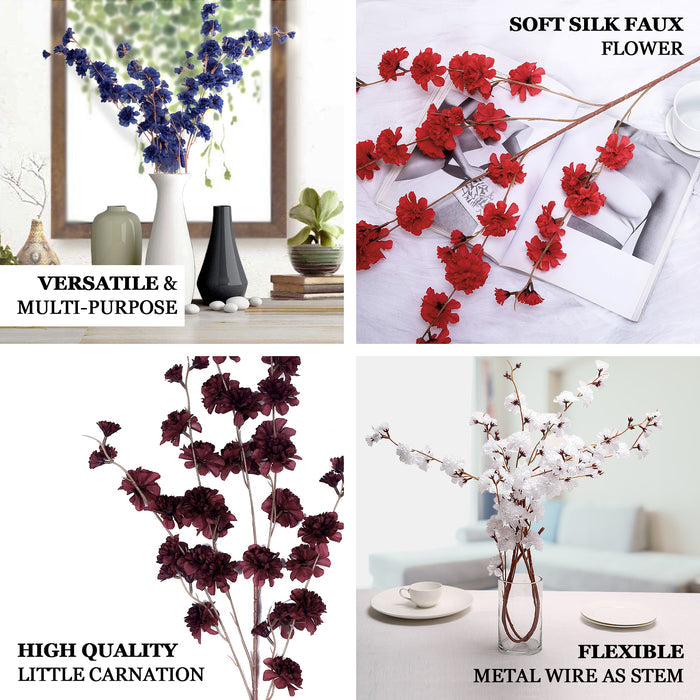 Blush artificial silk carnation flower stems in a decorative arrangement.