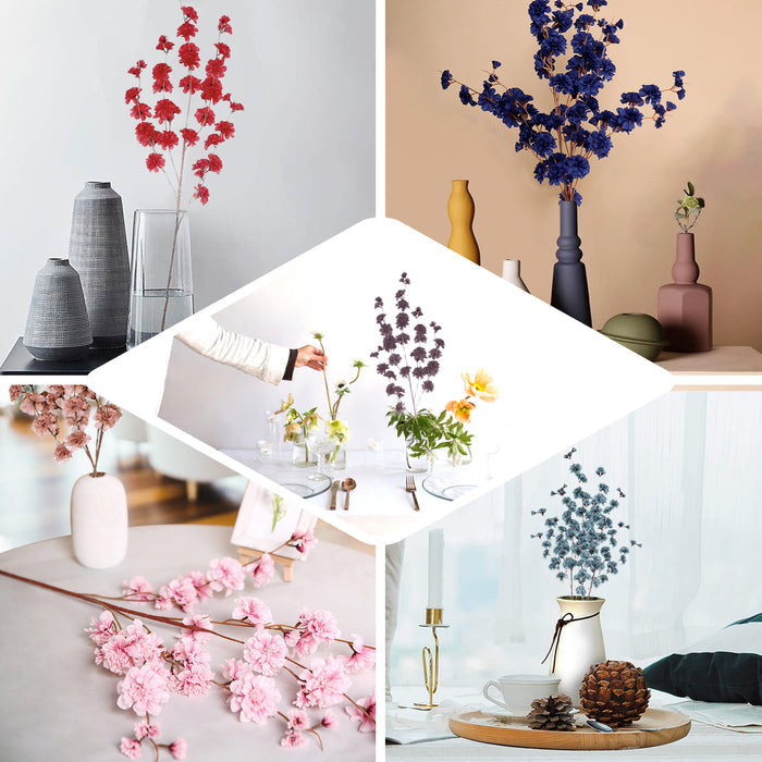 White artificial silk carnation flower stems in a decorative arrangement.