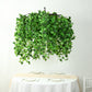 Green artificial eucalyptus leaf vines chandelier with draping ivy leaves.