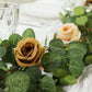 Cream and gold artificial eucalyptus garland with silk roses.