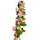 Blush dusty rose artificial silk flower garland with mini rose vines and green leaves.