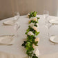 Cream ivory artificial silk flower garland with mini roses and greenery.