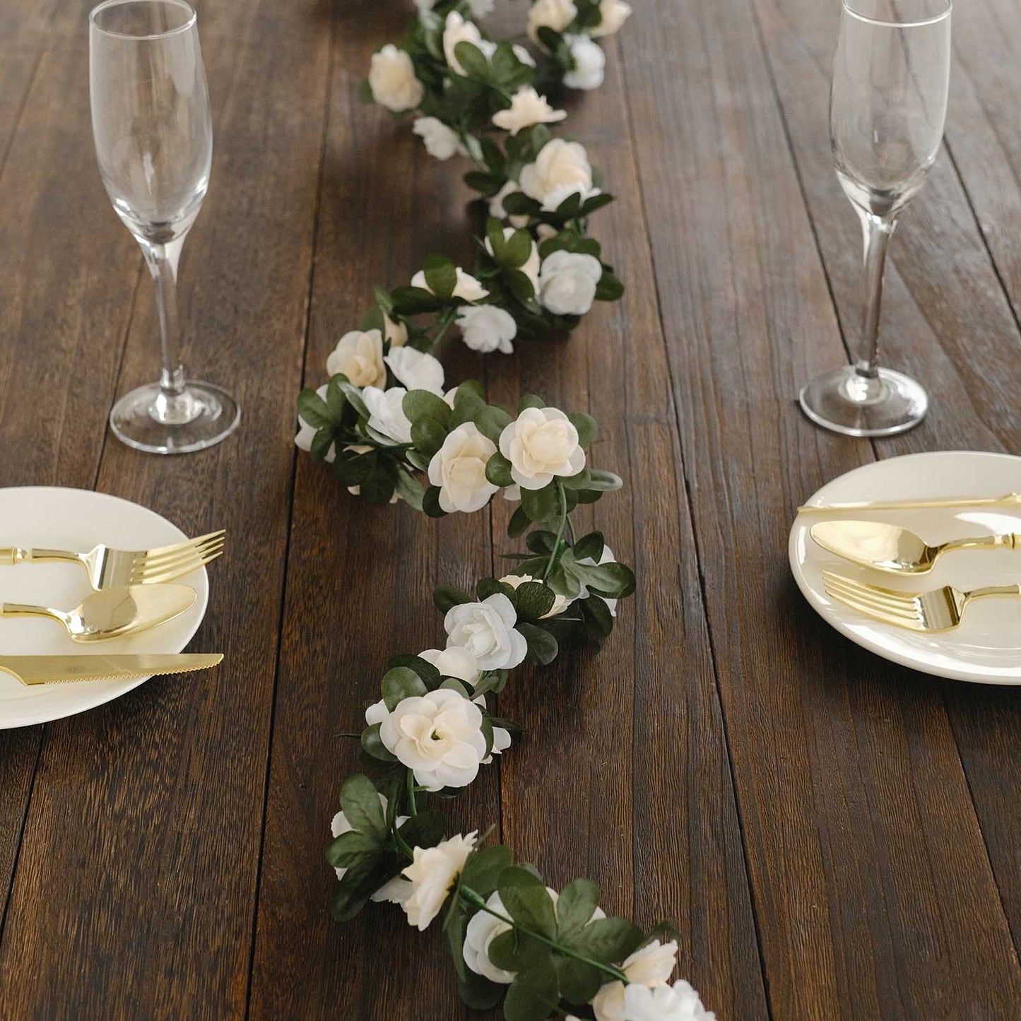 Cream ivory artificial silk flower garland with mini rose vines.