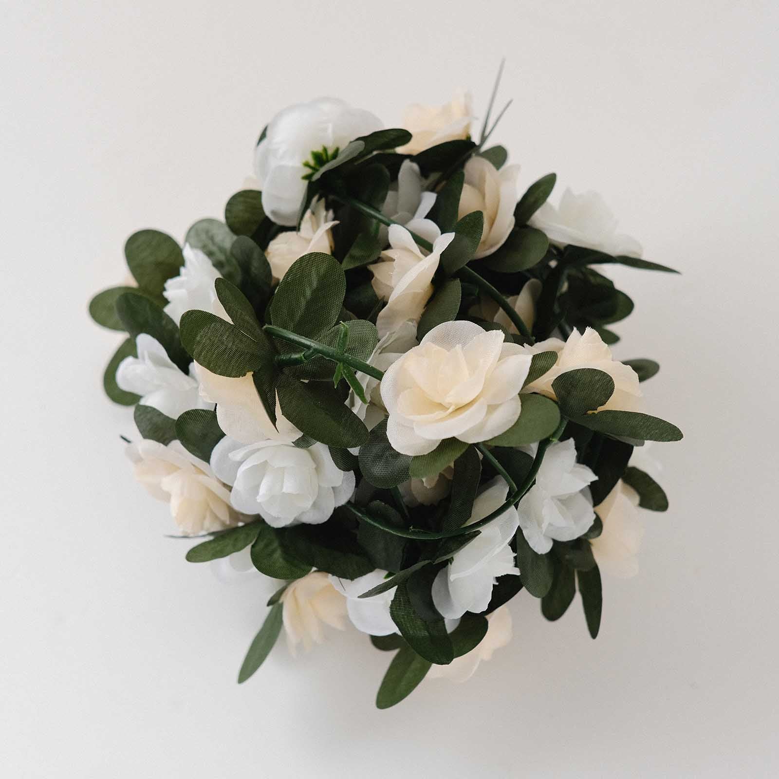 Cream ivory artificial silk flower garland with mini rose vines and green leaves.