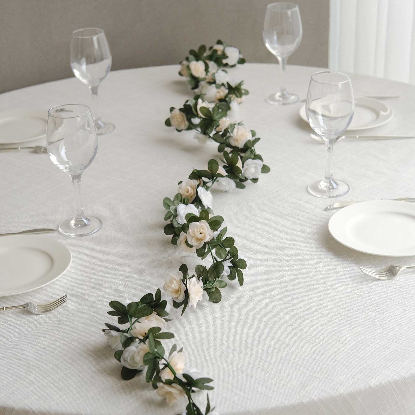 Cream ivory artificial silk flower garland with mini rose vines and flower heads.