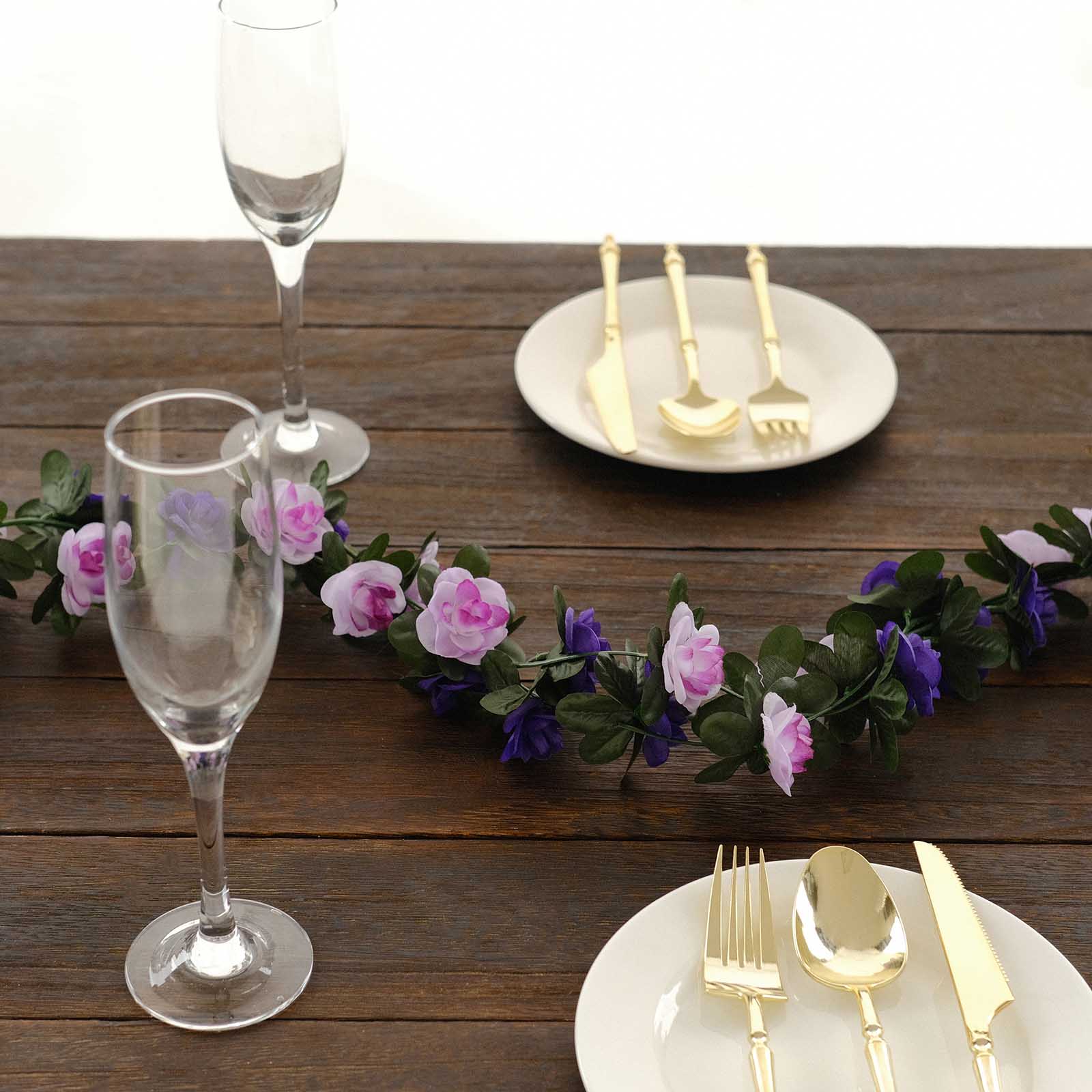 Lavender purple artificial silk flower garland with mini roses on a table setting.