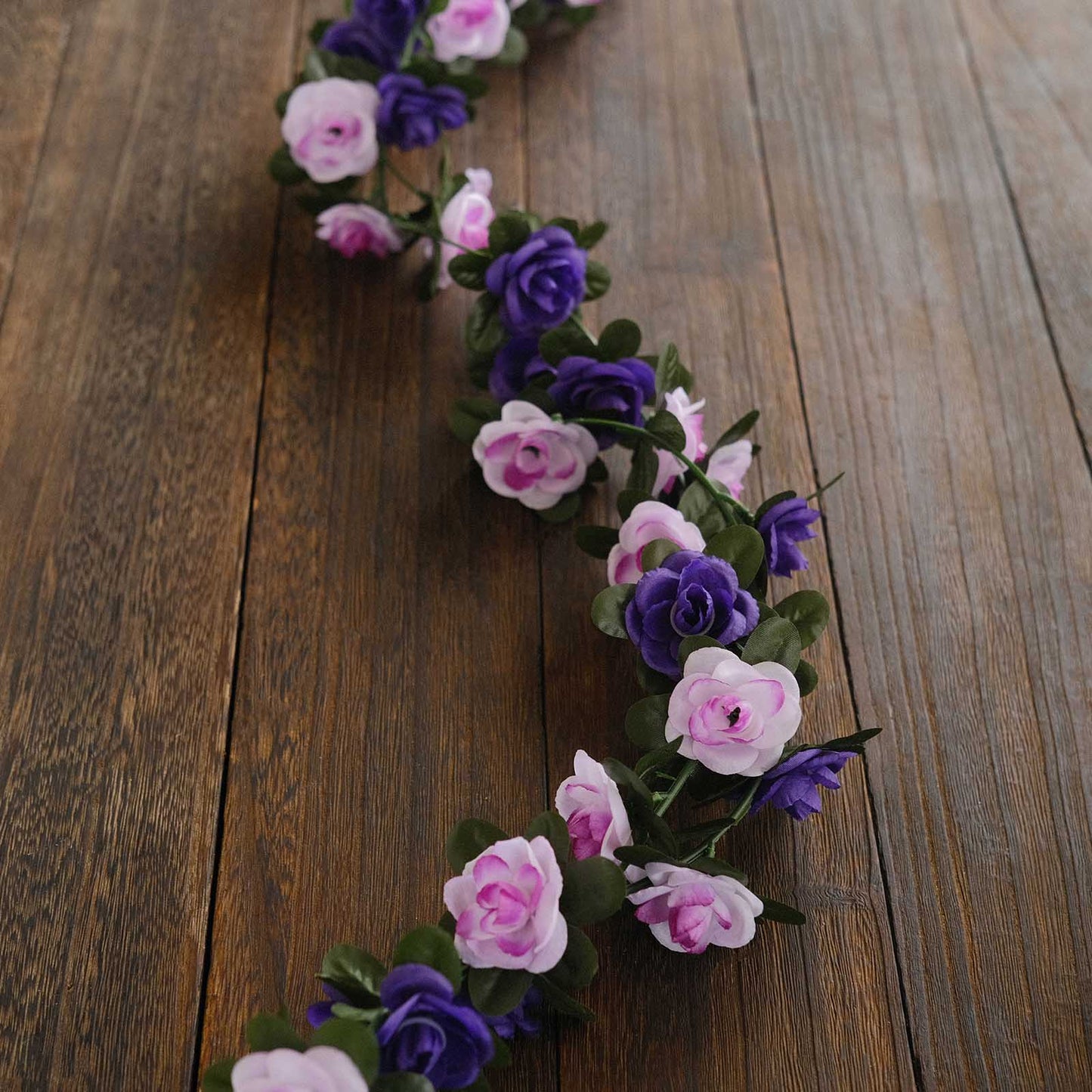 Lavender purple artificial silk flower garland with mini rose vines.