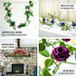 Cream artificial rose and leaf garland vine for decorative use.