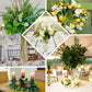Green artificial lemon leaf branches for home decor.