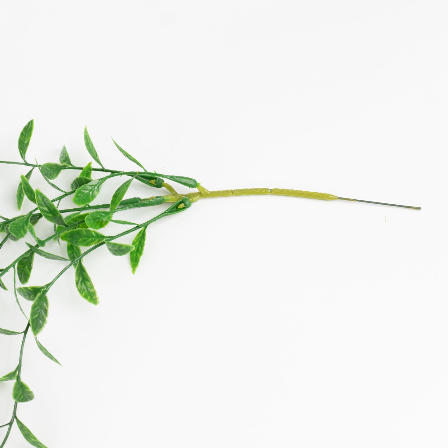 Green artificial hanging vines with weeping willow leaves, perfect for decor.