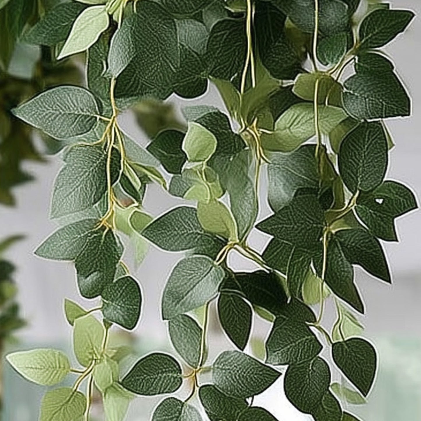 Realistic green silk rose leaf hanging plants for home and event styling.