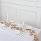 Metallic gold artificial monstera leaf hanging vine table garland.