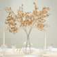 Gold metallic artificial leaf spray arrangement in a clear vase.