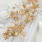 Metallic gold artificial ivy leaves garland for table and backdrop decor.