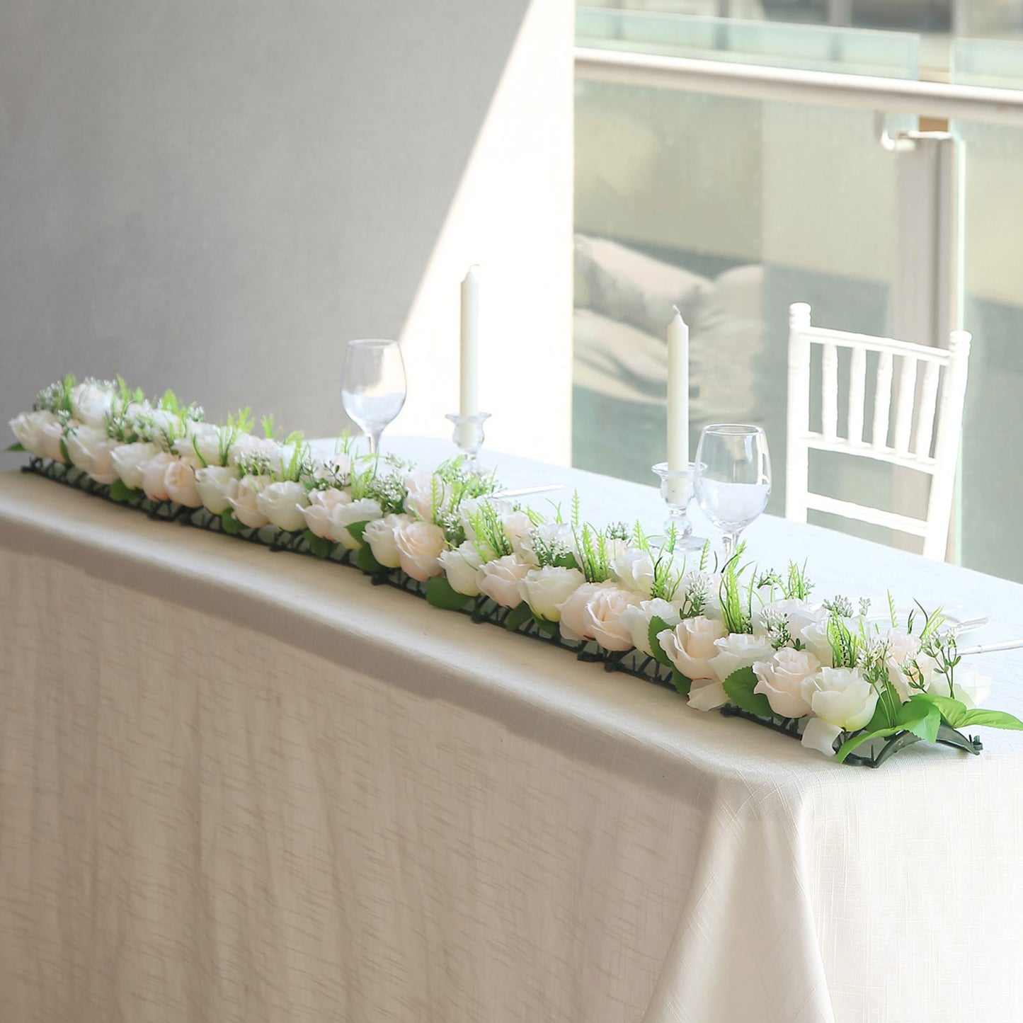 Cream ivory silk rose flower table runner with green accents.