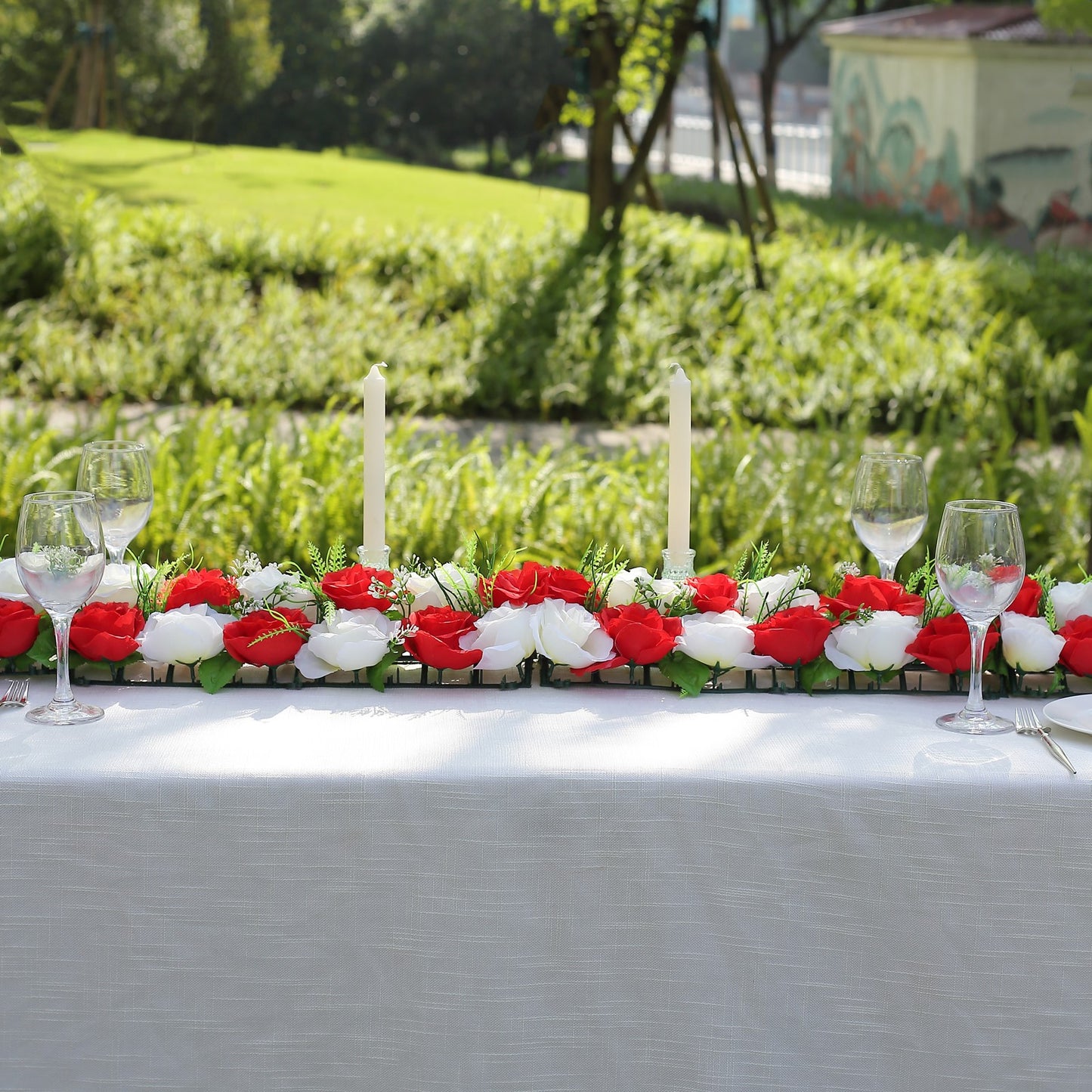 Red and ivory silk rose flower table runner centerpiece.