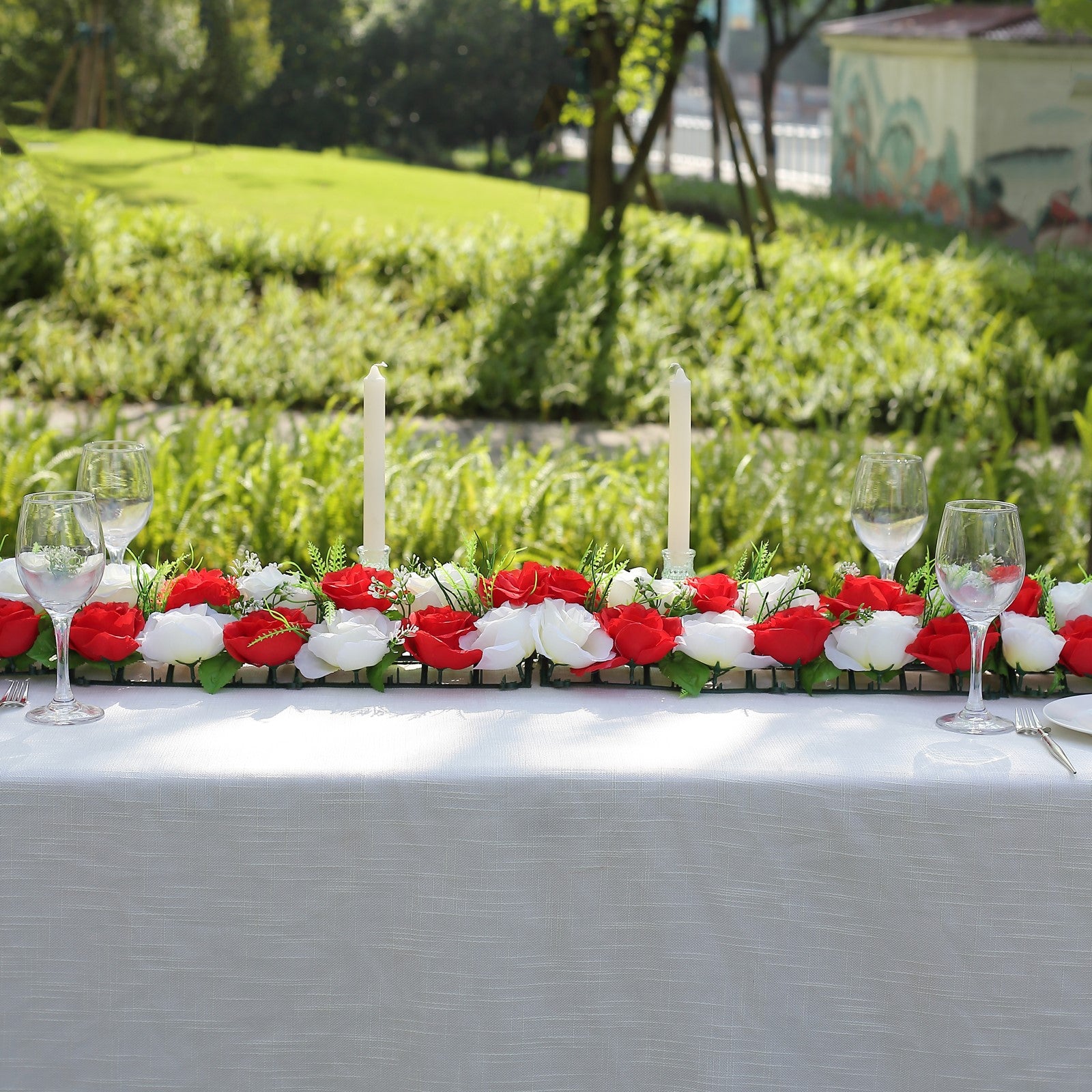 Red and ivory silk rose flower table runner centerpiece.