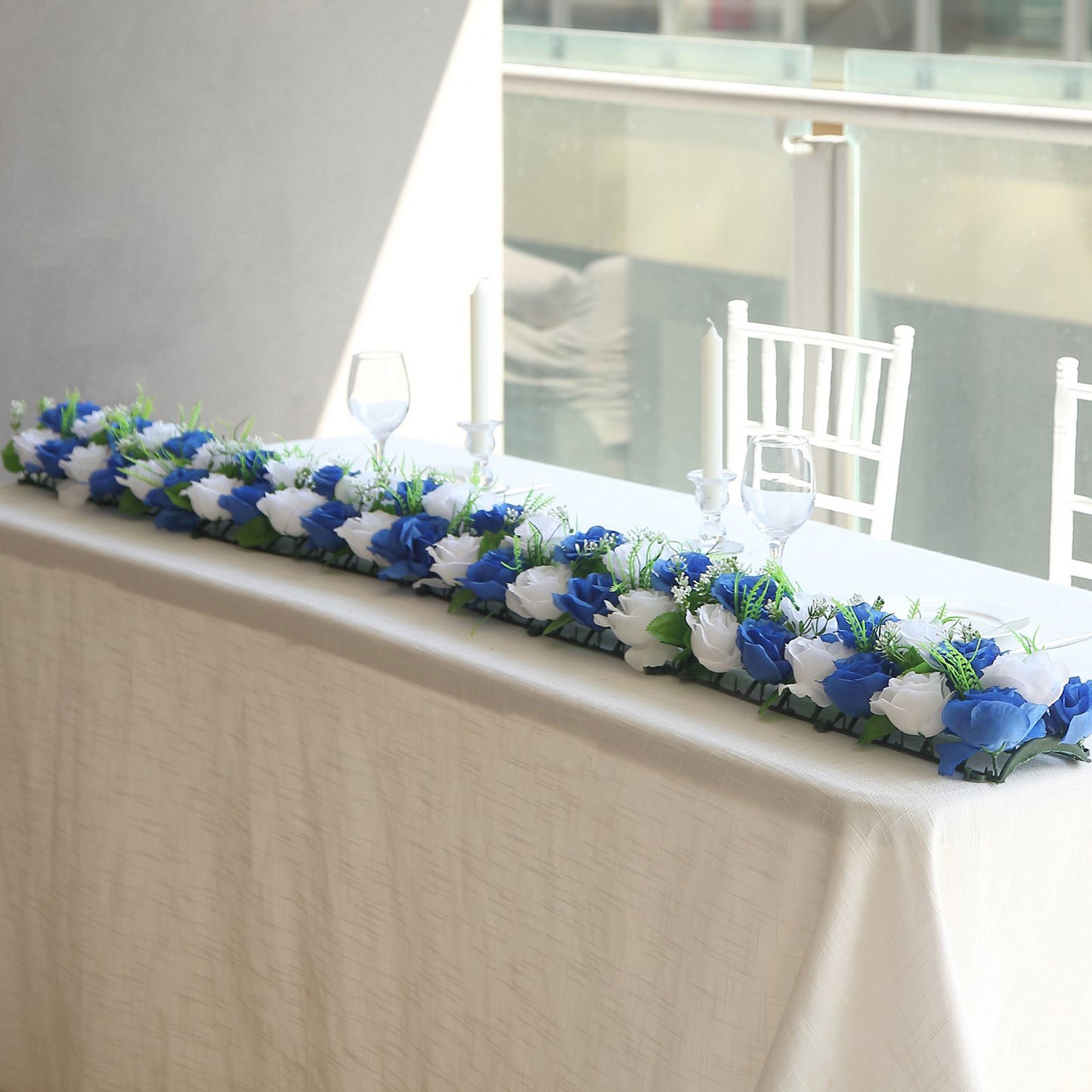 White and royal blue silk rose flower table runner centerpiece.