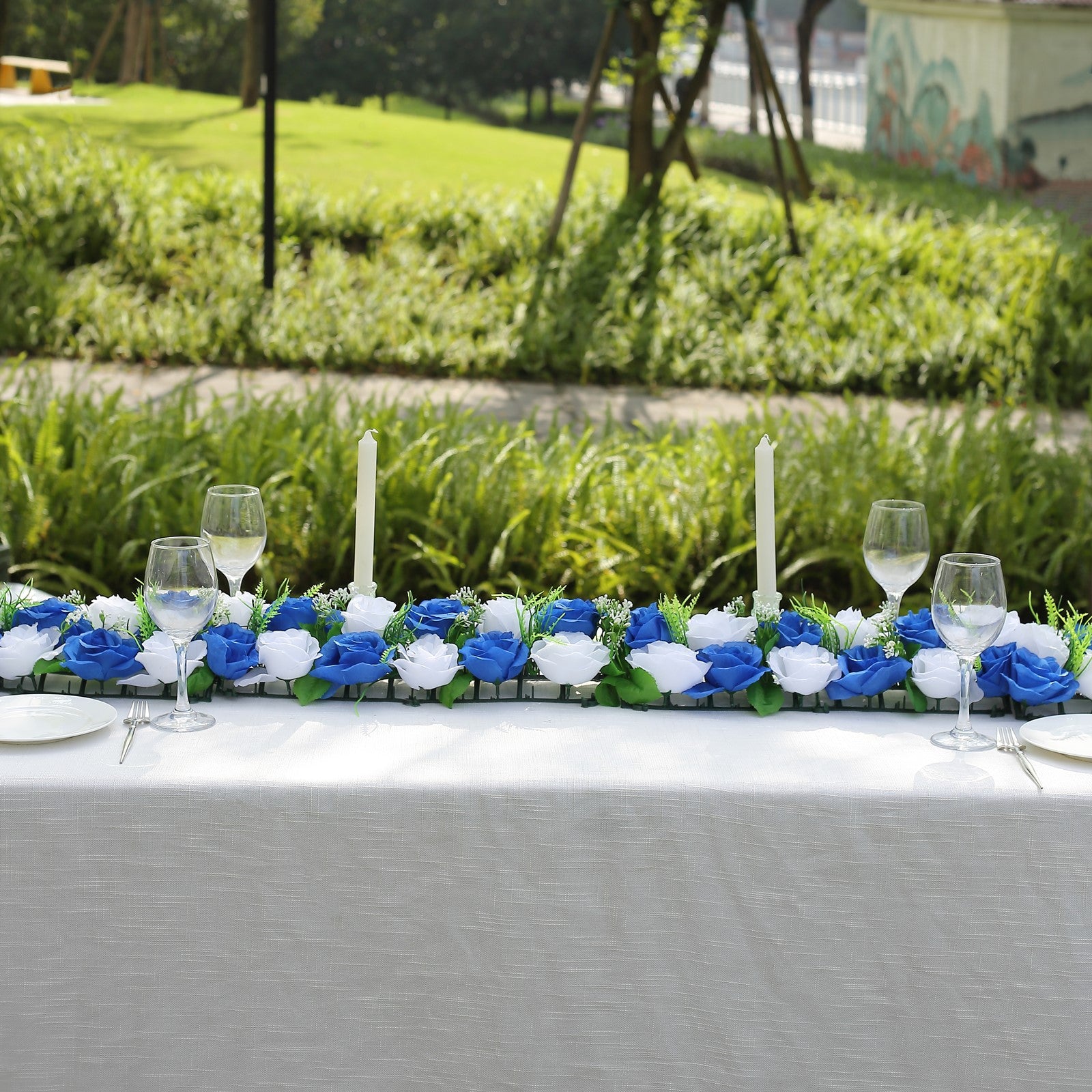 White and royal blue silk rose flower table runner centerpiece.