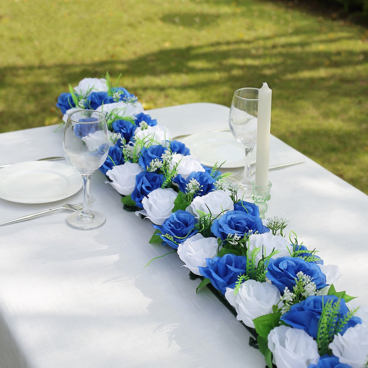 White and royal blue silk rose flower table runner centerpiece.