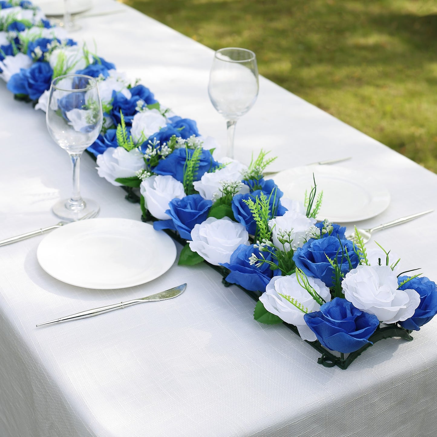 White and royal blue silk rose flower table runner centerpiece.