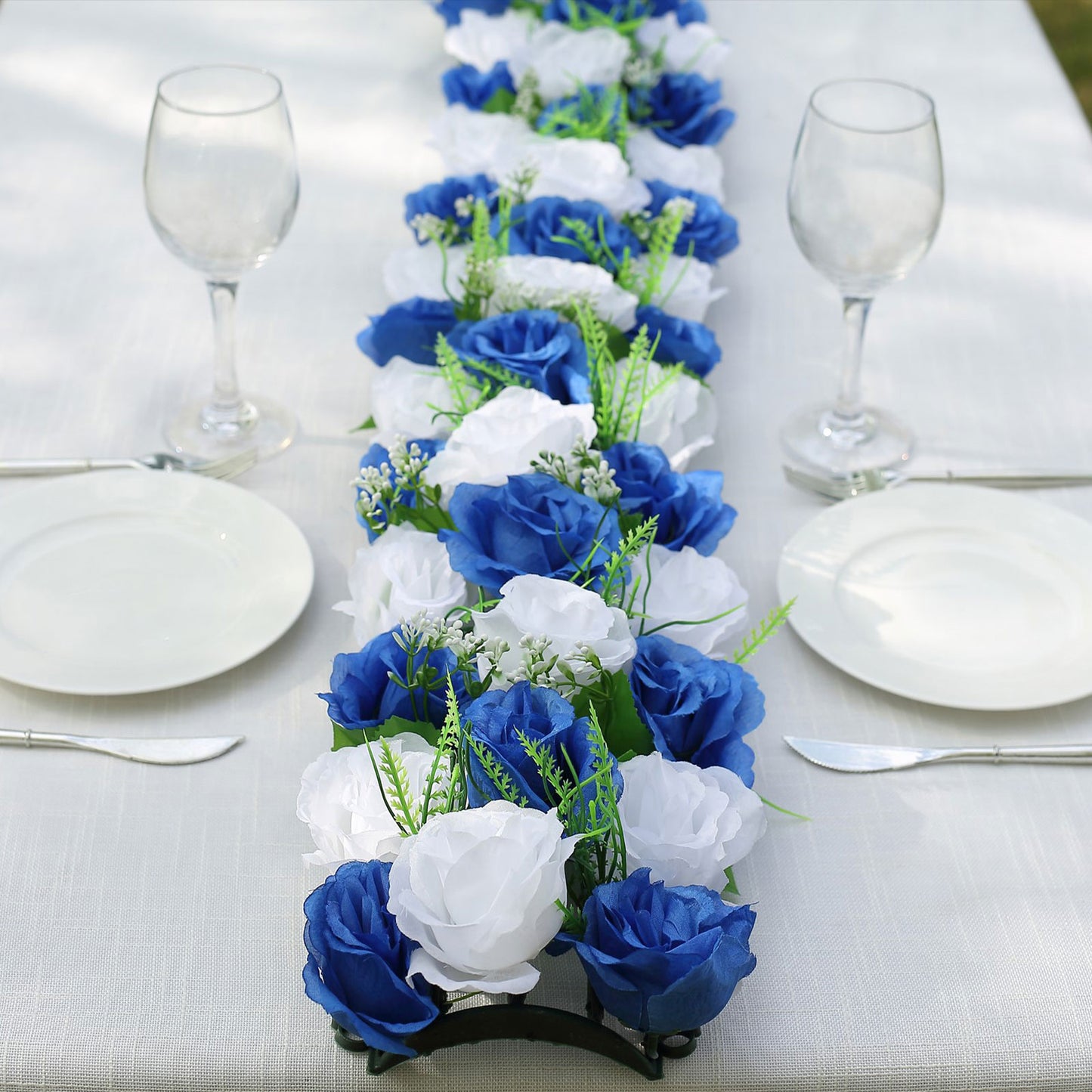 White and royal blue silk rose flower table runner centerpiece.