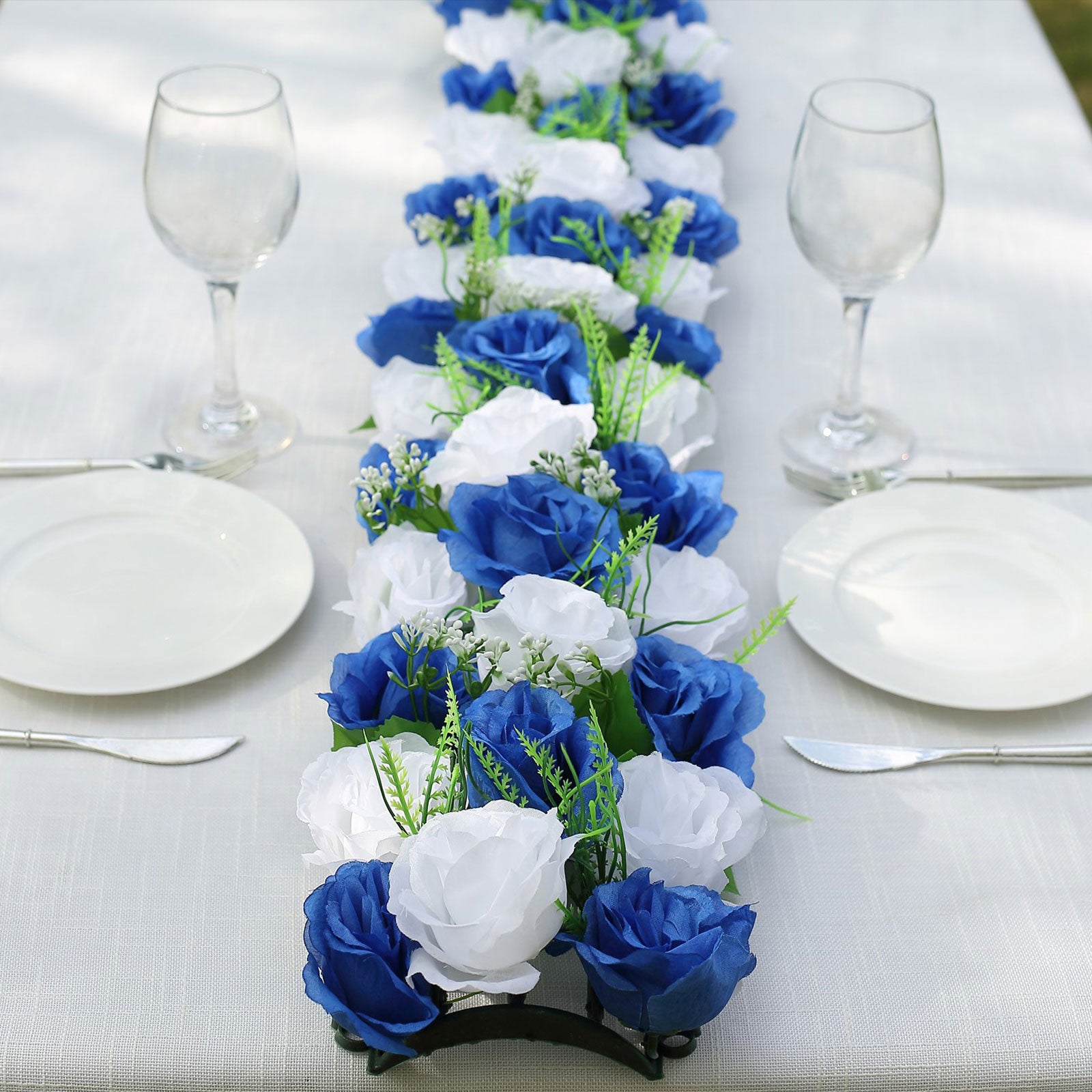 White and royal blue silk rose flower table runner centerpiece.