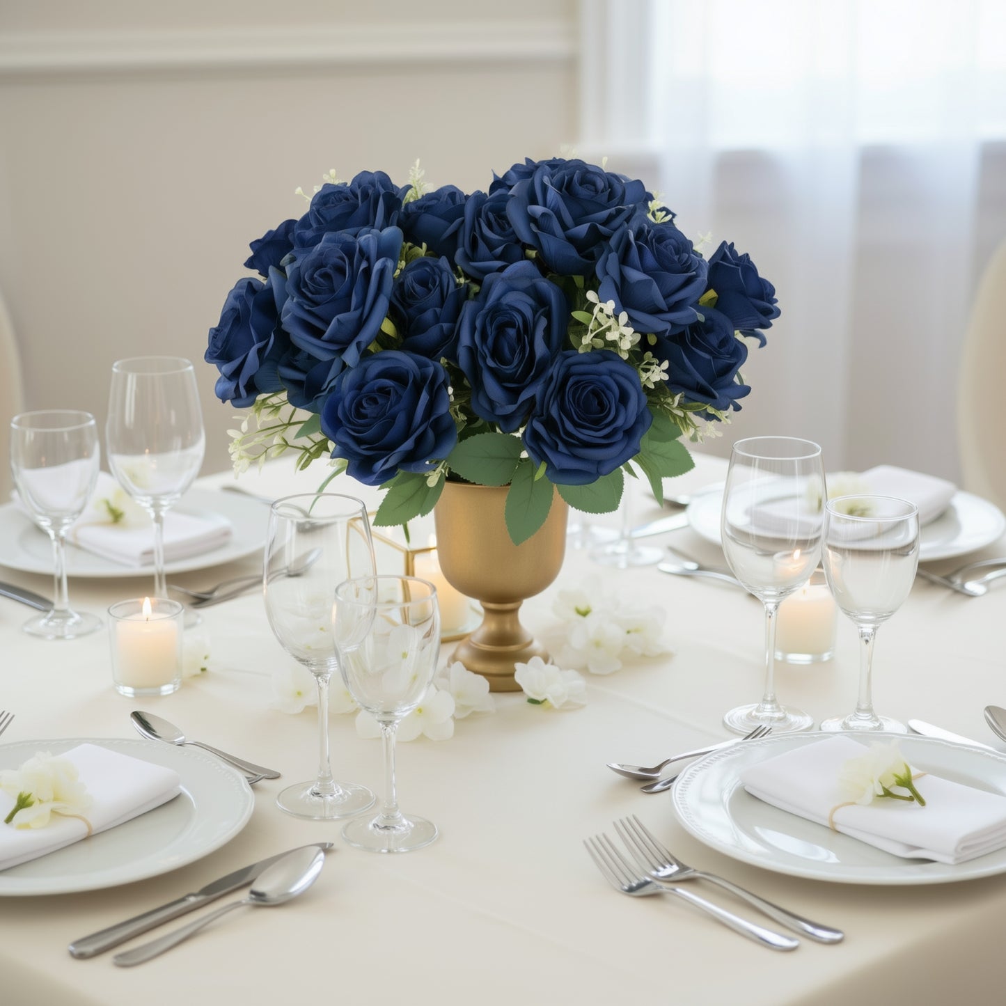 Navy blue artificial silk rose flower arrangement in a gold vase on a dining table.
