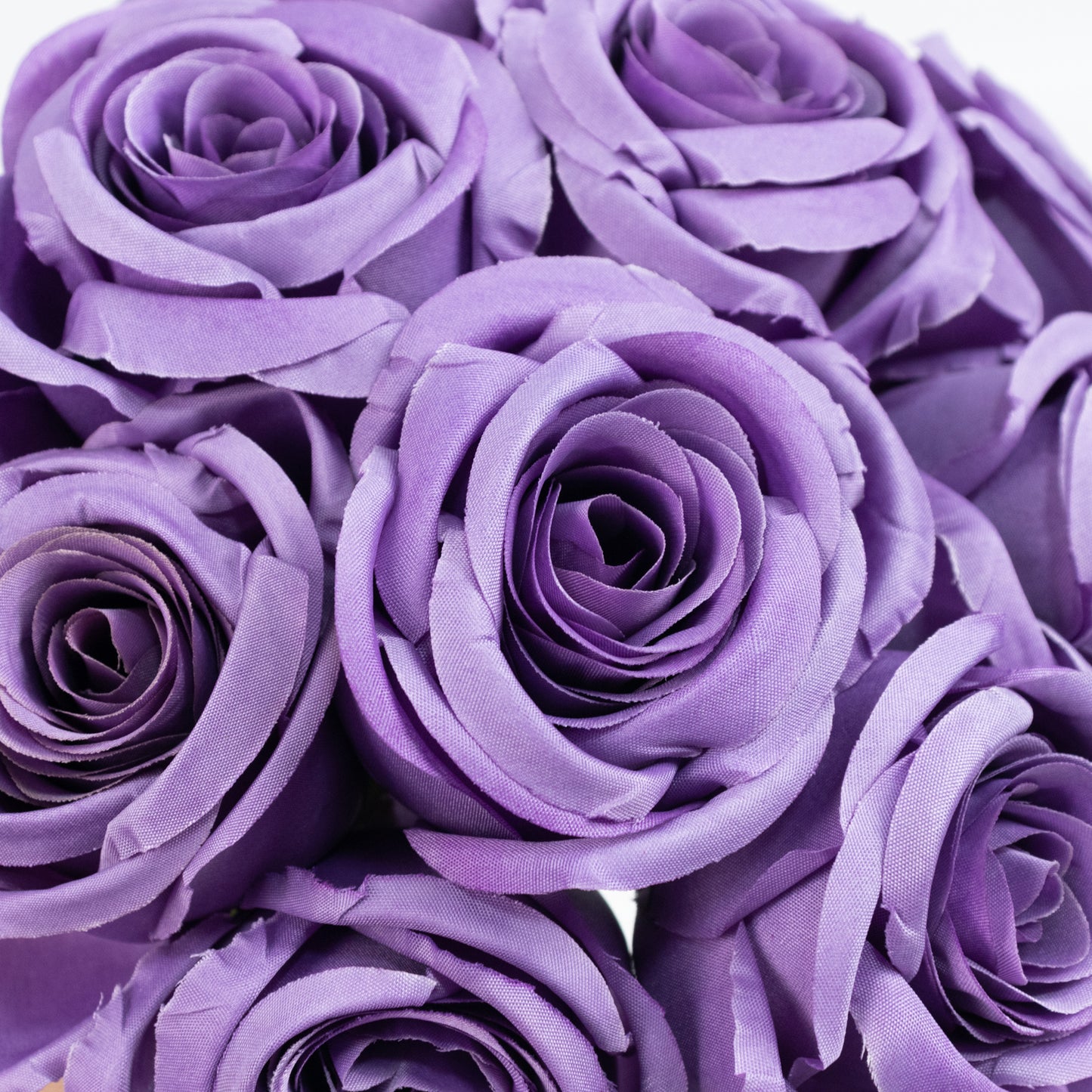 Purple artificial silk roses for bouquet arrangements.